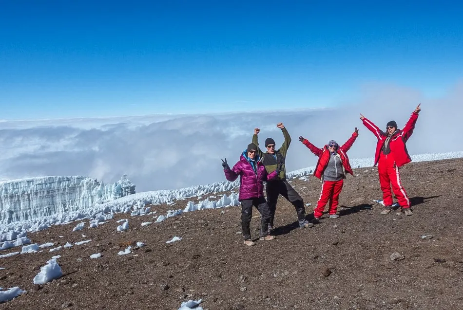 Kilimanjaro hikers wearing warm layered clothing at high altitude
