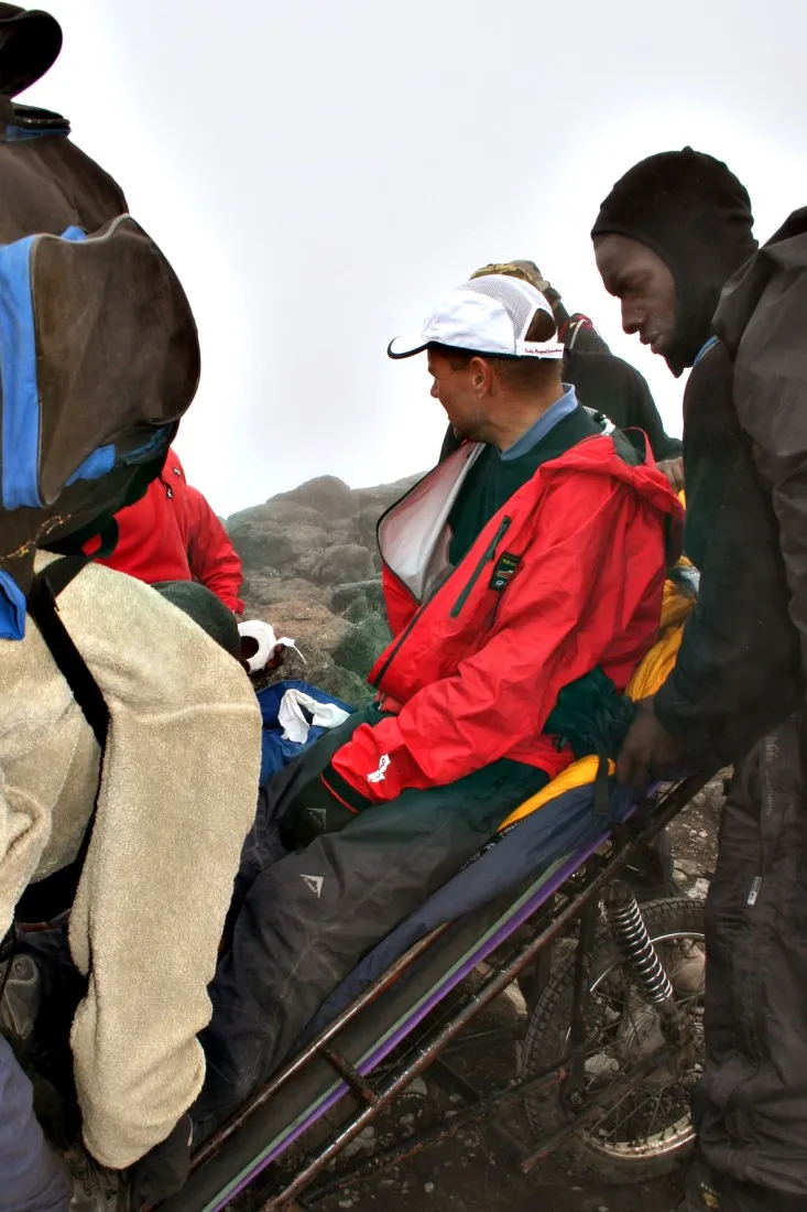 Mountain team assisting with a stretcher evacuation on Kilimanjaro