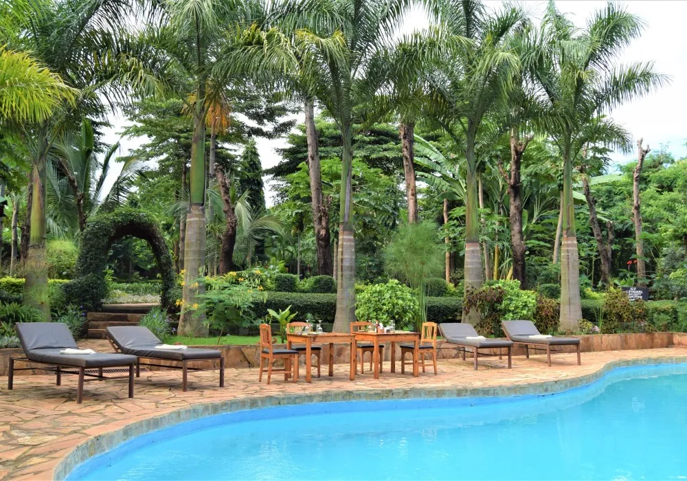 Swimming pool and gardens at Chanya Lodge in Moshi