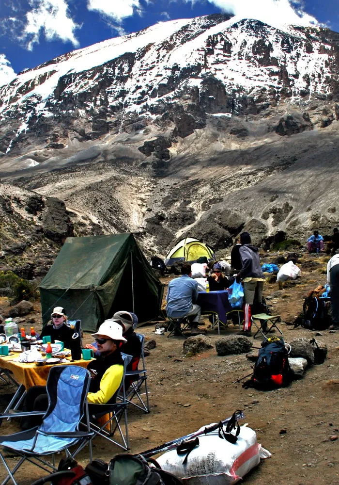 Hikers enjoying lunch during a day climbing Mount Kilimanjaro