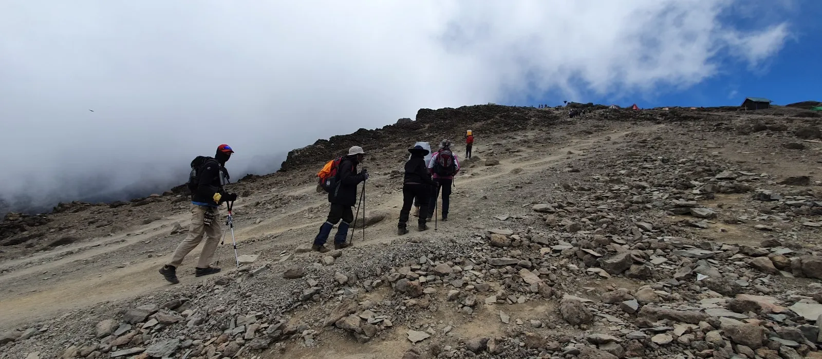Hikers trekking at high altitude on Mount Kilimanjaro