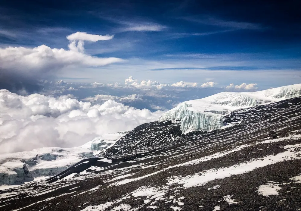 Arctic summit zone on Mount Kilimanjaro with exposed rock, snow, ice and high-altitude terrain
