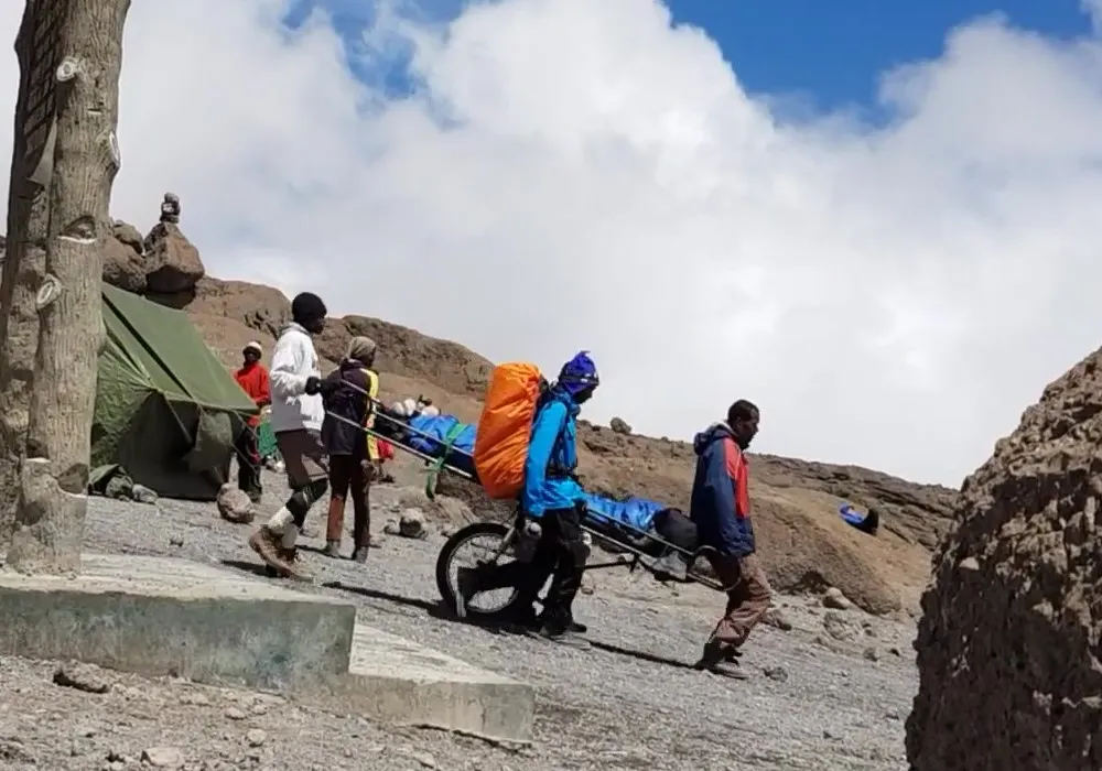 Hiker being evacuated by stretcher on Mount Kilimanjaro