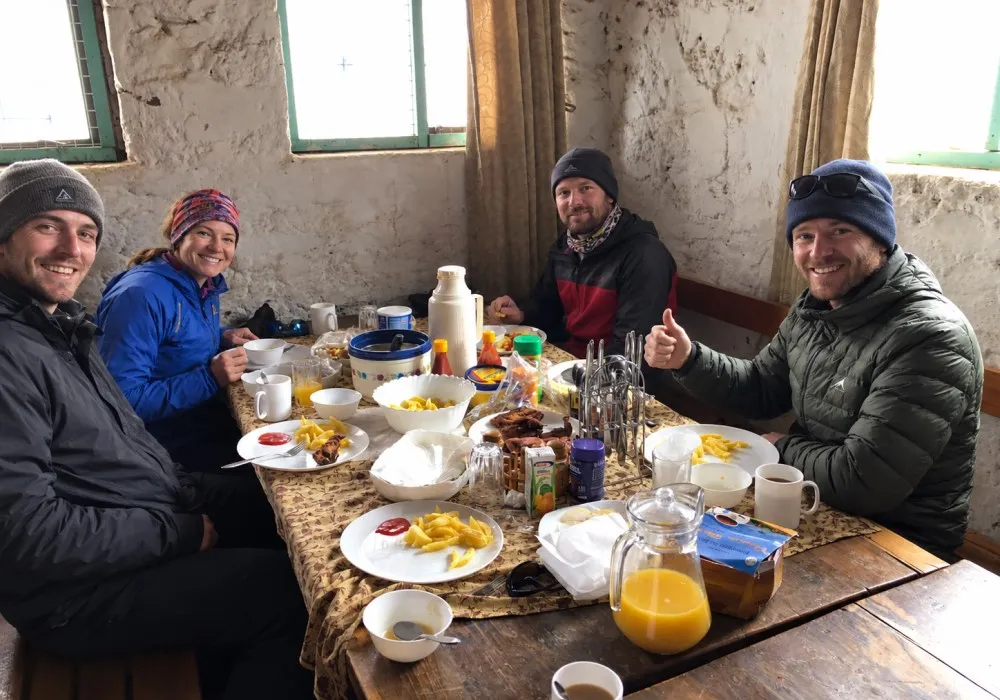 Hikers enjoying a meal at Kibo Hut on Mount Kilimanjaro