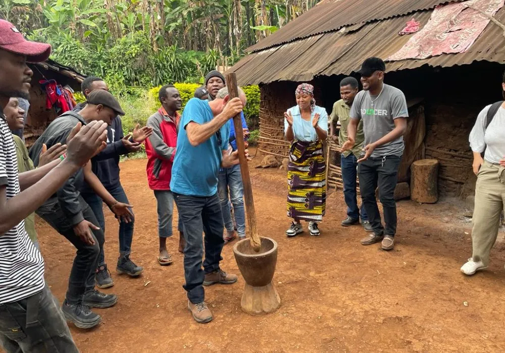 Visitors enjoying a cultural village experience near Moshi Tanzania